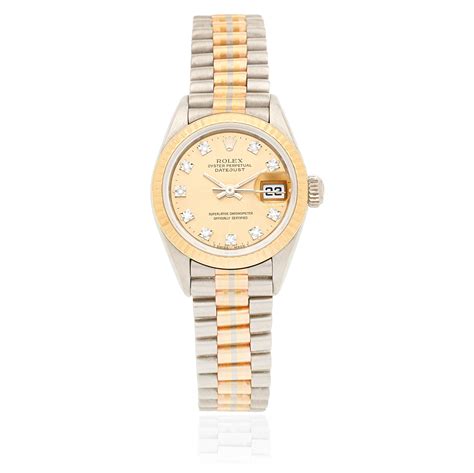 Rolex. A lady's 18K gold diamond set automatic calendar